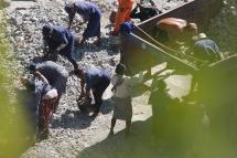 Prisoners are seen in Mon State’s Zin Kyeik Labour Camp quarry, manually breaking rocks while shackled at the legs. Photo: Swe Win / Myanmar Now
